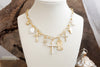 Radiant Faith – Mixed Charm Cascade Necklace in Gold Tone