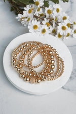 Multi size ball beaded bracelet stack Gold tone bracelet set