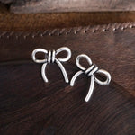Western Bow Statement Earrings – Worn Silver Tone