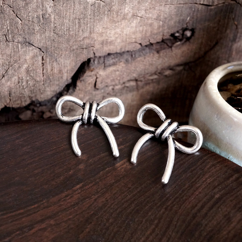 Western Bow Statement Earrings – Worn Silver Tone