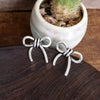Western Bow Statement Earrings – Worn Silver Tone