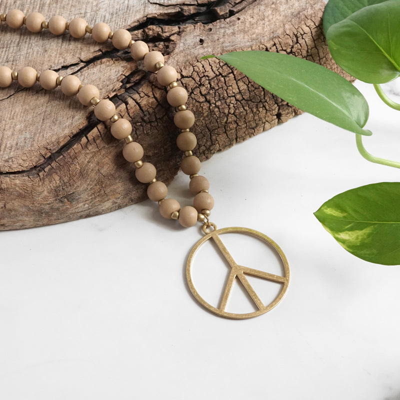 Long Wood Bead Necklace with golden peace sign pendant - Natural Beige