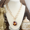 Gilded Radiance – Chunky Ring Chain Necklace with Sparkly Crystal