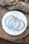 Worn gold tone and glass beads bracelets stack Hot Pink Blue Green