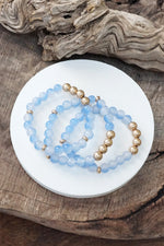 Worn gold tone and glass beads bracelets stack Hot Pink Blue Green