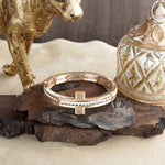 Golden Balance – Minimalist Sideways Cross Stretch Bangle