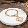 Divine Gleam – Hammered Cross Toggle Bracelet with Pearls & Crystals