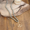 Long Wood Bead Necklace with golden peace sign pendant - Gray