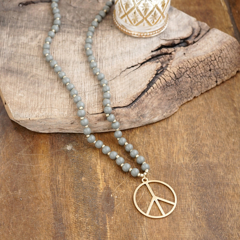 Long Wood Bead Necklace with golden peace sign pendant - Gray