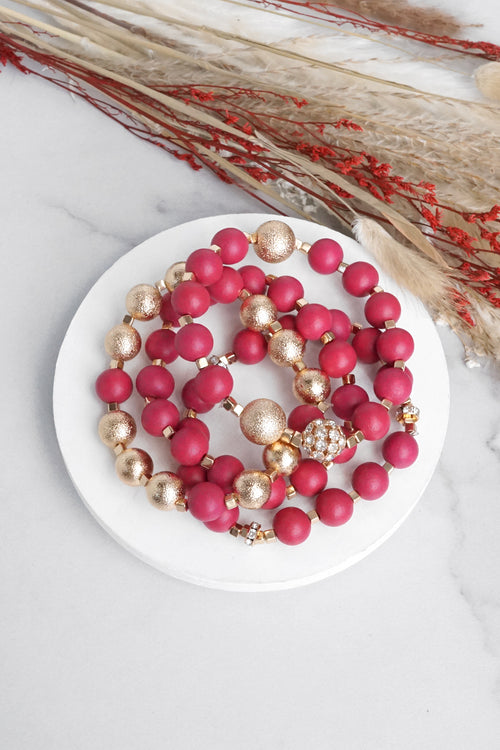 Beaded bracelets set in Red and Gold with clear crystals