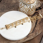 Chain Reaction – Multi-Layer Bracelet Stack in Gold Tone