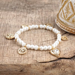 Golden Reverie – Multi-Charm Pearl Stretch Bracelet