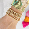 Worn Gold tone multi size beaded bracelet stack of 6 bracelets