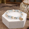 Whispering Light – Mixed Bead Bracelet with Golden Coin Charm