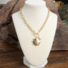 Front Toggle Hammered Coin & Crystal Charm Necklace – Gold Tone