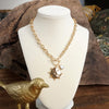 Front Toggle Hammered Coin & Crystal Charm Necklace – Gold Tone