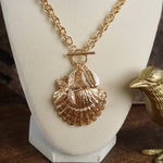 Front Toggle Multi-Charm Shell Statement Necklace – Gold Tone