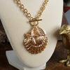 Front Toggle Multi-Charm Shell Statement Necklace – Gold Tone