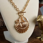 Front Toggle Multi-Charm Shell Statement Necklace – Gold Tone