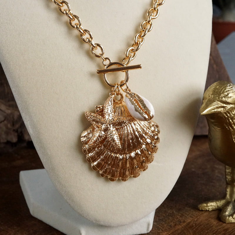 Front Toggle Multi-Charm Shell Statement Necklace – Gold Tone
