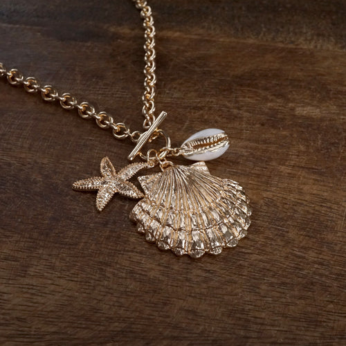 Front Toggle Multi-Charm Shell Statement Necklace – Gold Tone