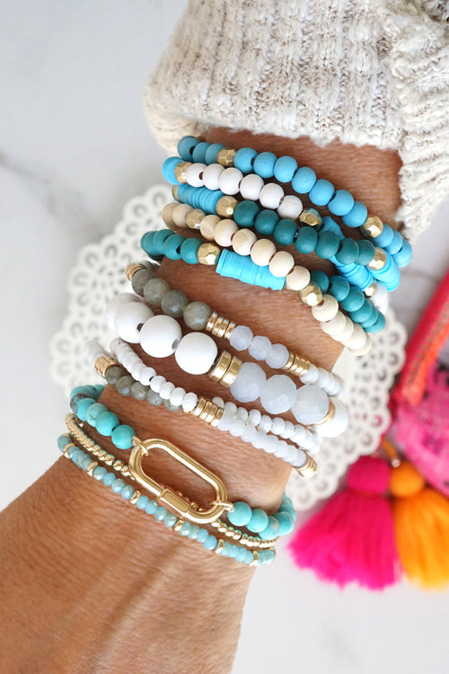 Blue stack of 5 clay and wood beads bracelets in blues and white