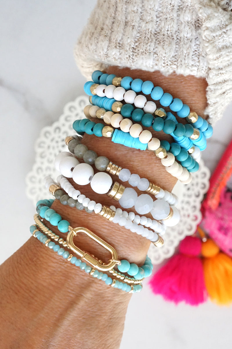 Blue stack of 5 clay and wood beads bracelets in blues and white