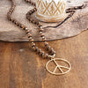 Long Wood Bead Necklace with golden peace sign pendant - Brown