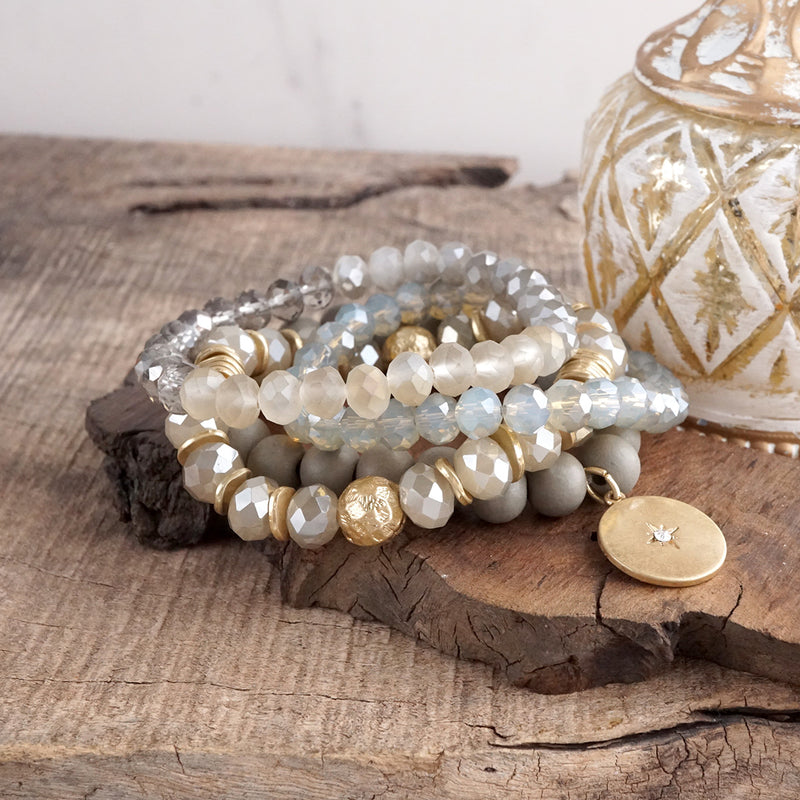 Beaded bracelets set in Gray with a coin charm