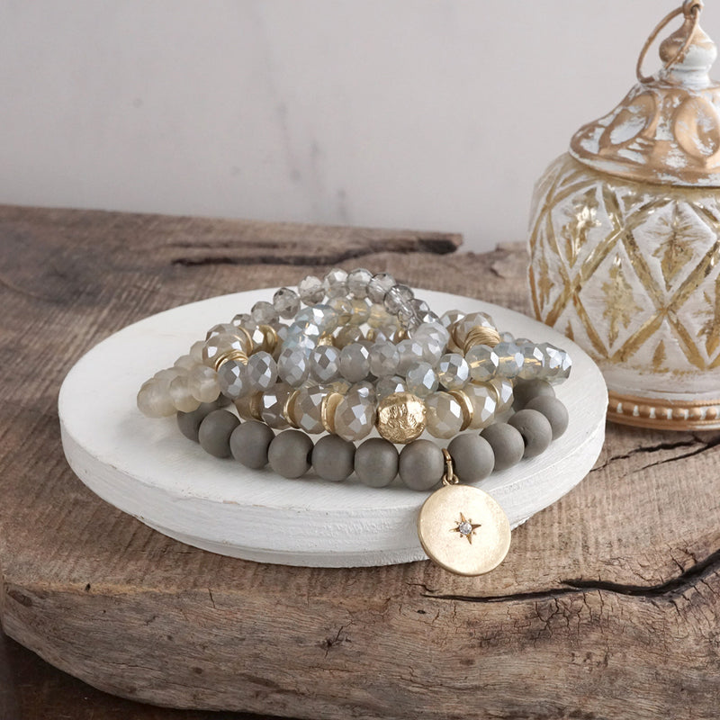 Beaded bracelets set in Gray with a coin charm