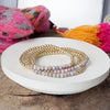 Small Worn Gold tone and Glass beads bracelet stack of 4 bracelets